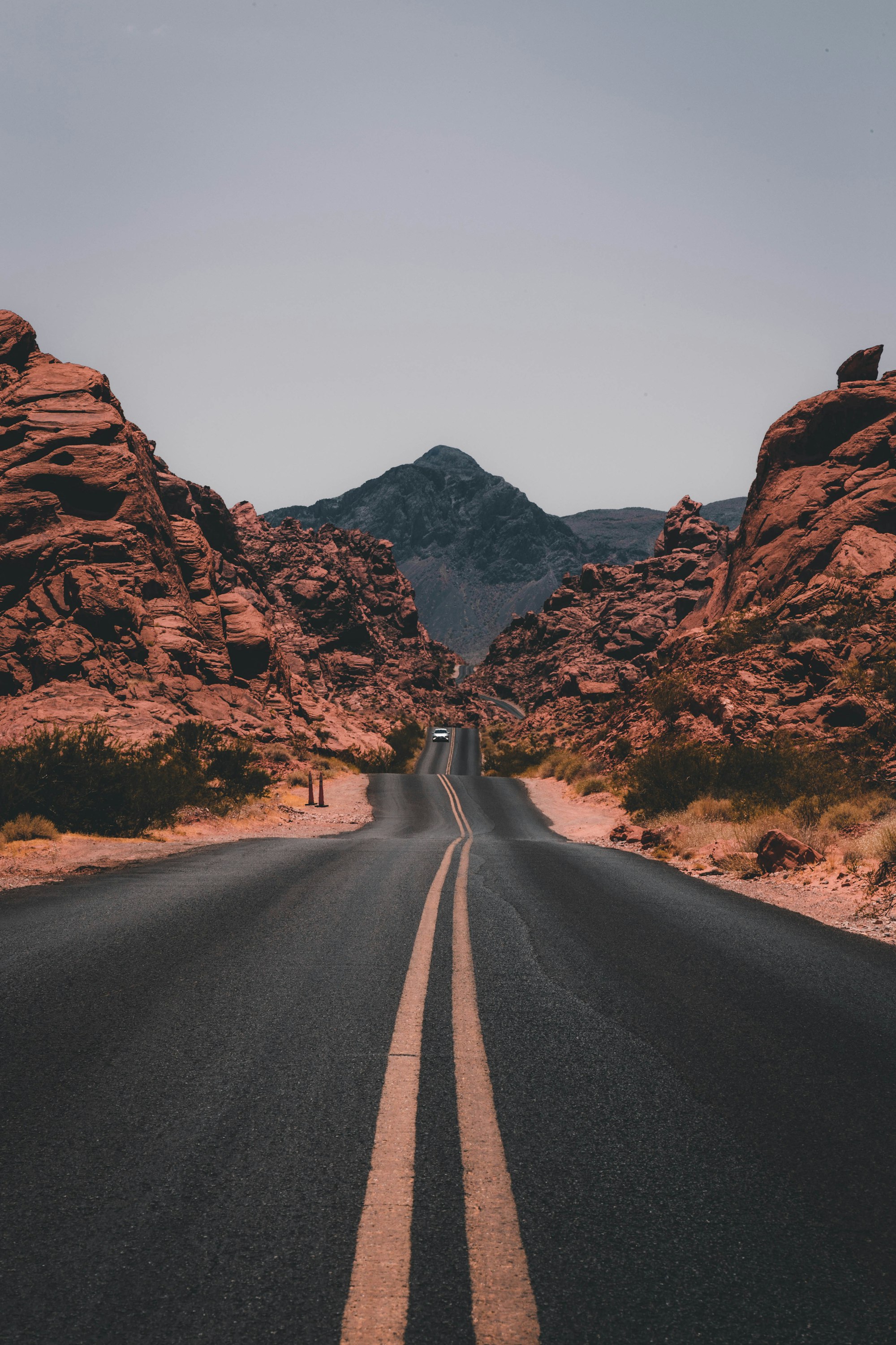 Open road through wild hills